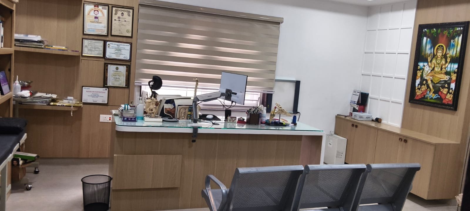Dr Balaji Reddy Consultation Chamber with certificates and joint models