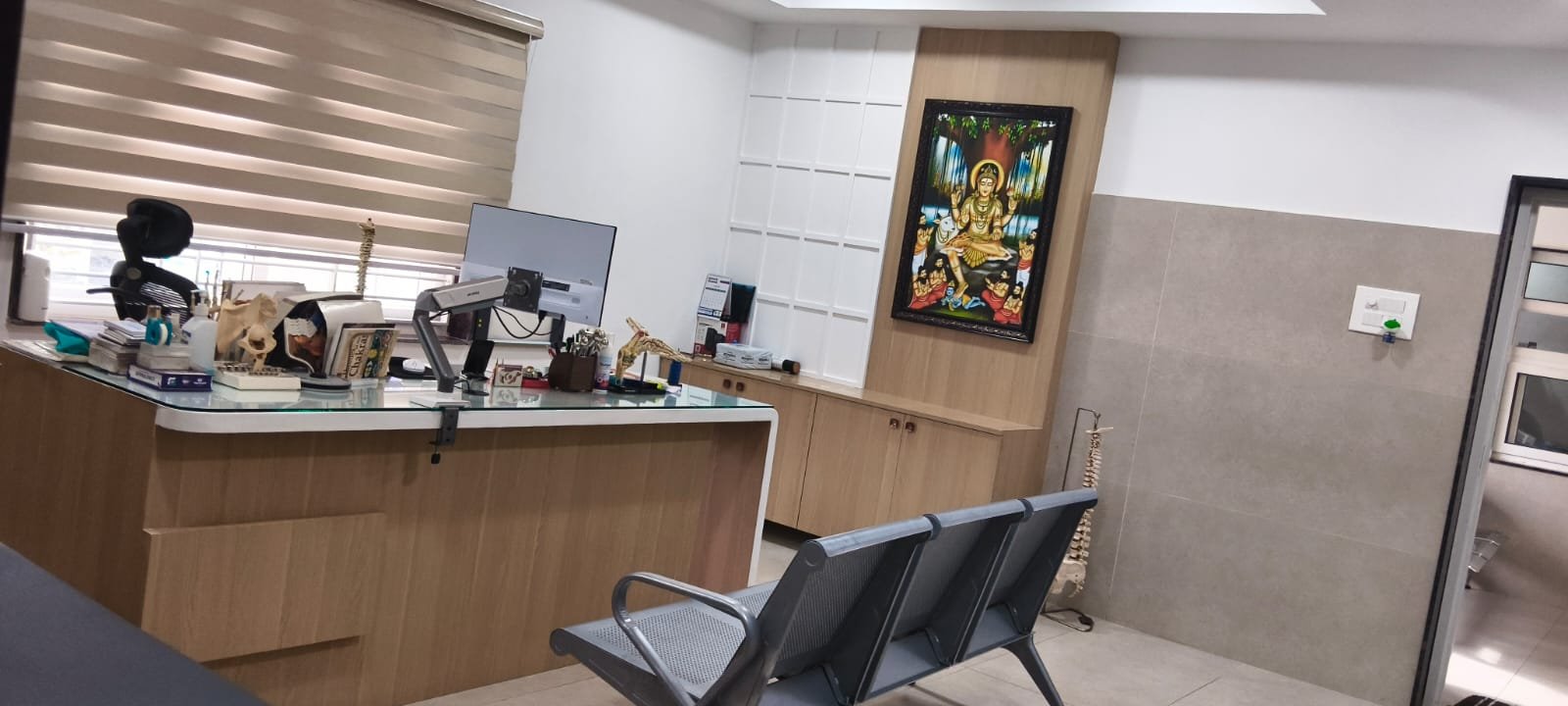 Orthopaedic diagnostic desk with bone models and computer terminal